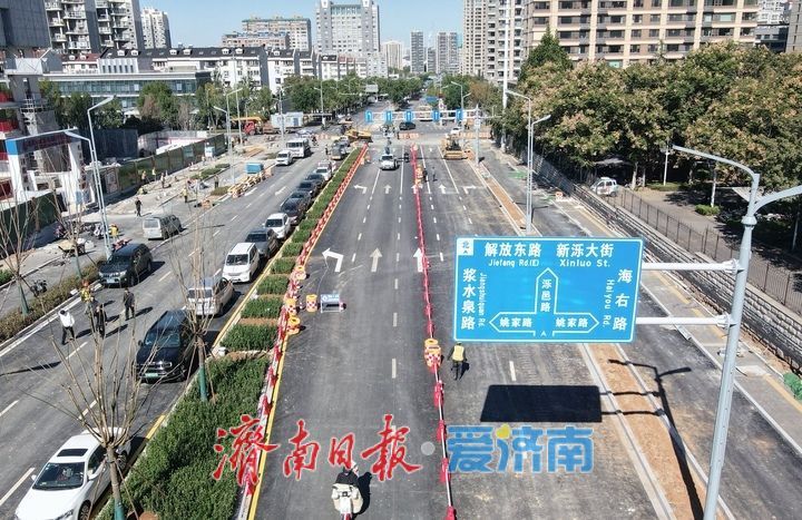 沥青摊铺、交通标识线就绪，济南泺邑路改造东侧路面临时放开非机动车通行